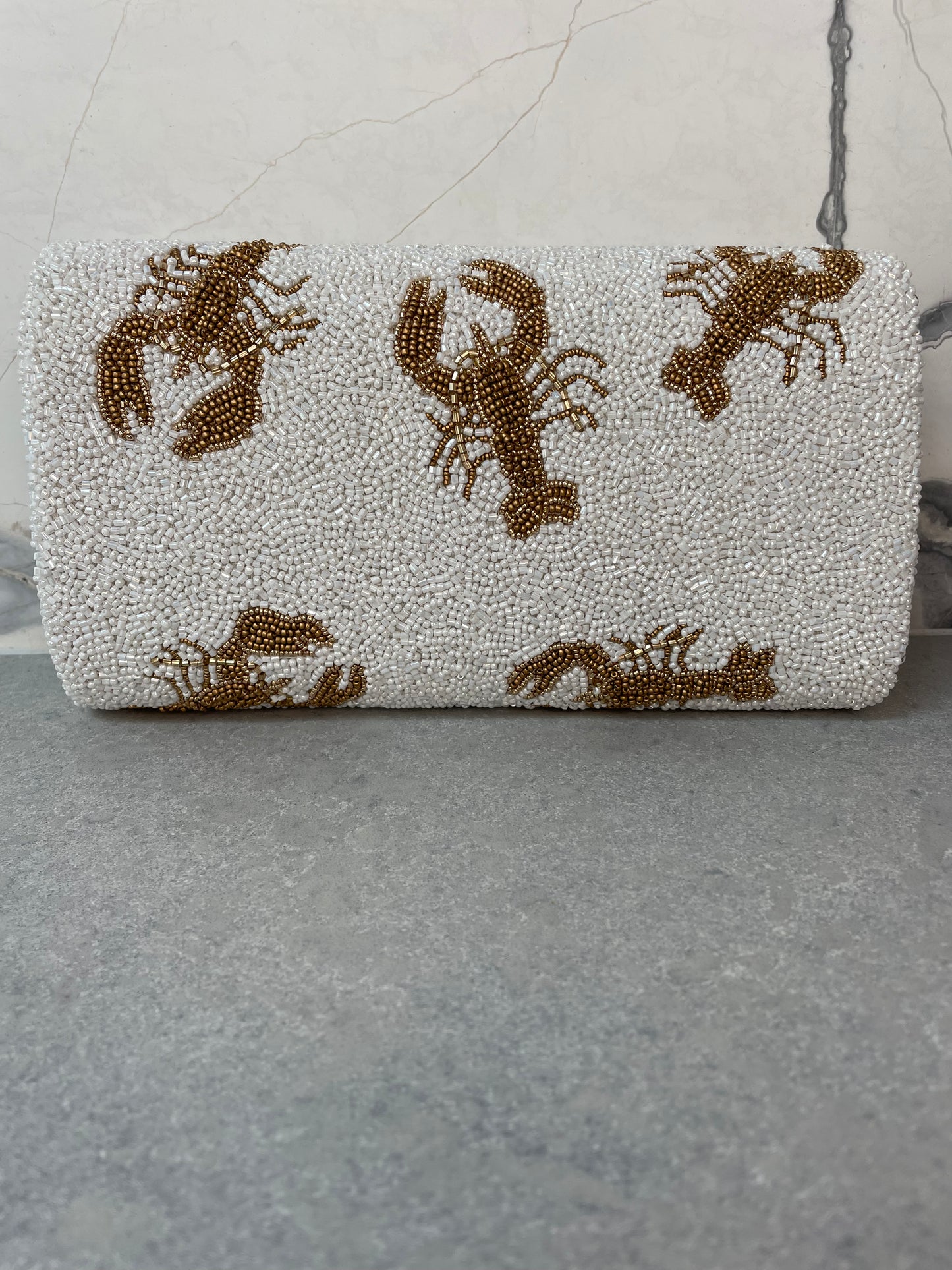 LOBSTER CLUTCH WHITE AND GOLD